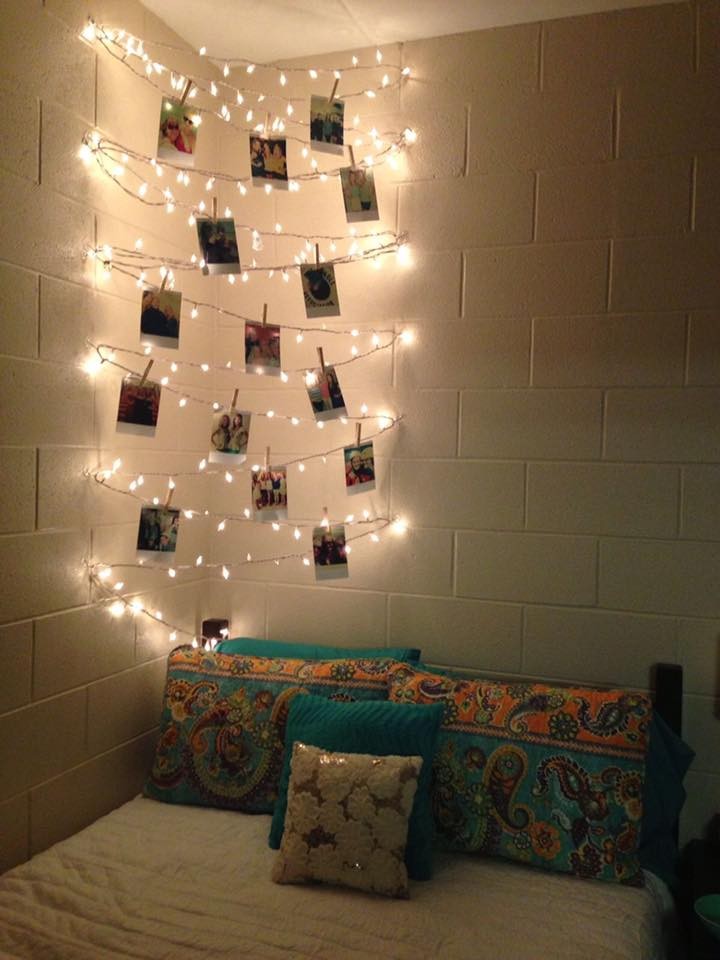 Bedroom with photos illuminated with lights