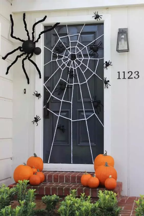 Halloween decorated doors with spiders and spiders